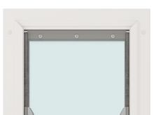 A close-up of a white-framed window with a gray top bar secured by three screws.