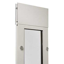 Partial view of a white metal framed structure with a white panel above a window.
