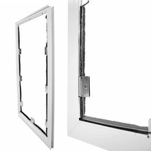 A white framed pet door with a magnetic closure.
