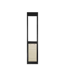 Black framed dog door with tan colored insert panel.