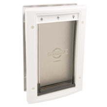 A PetSafe pet door with a white frame.