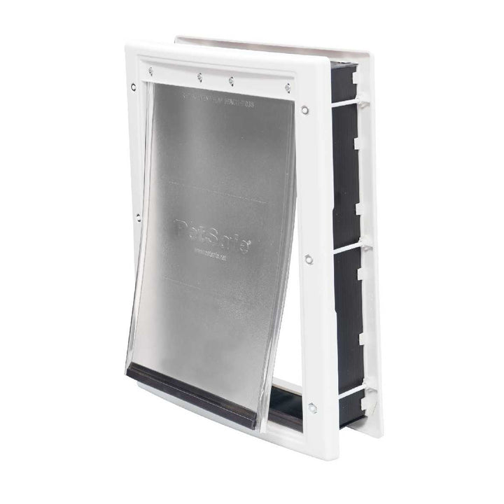 A PetSafe pet door with a flexible flap and white frame.