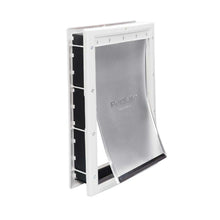 A PetSafe pet door with a white frame and a clear, flexible flap.