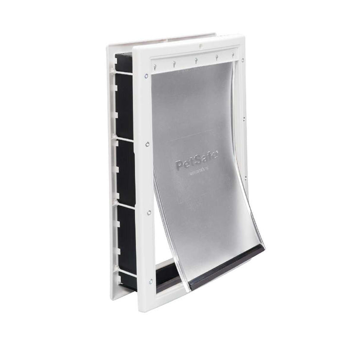 A PetSafe pet door with a white frame and a clear, flexible flap.
