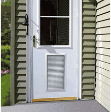 White door with a window, vent, and brass hardware, set against siding.