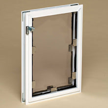 A white framed pet door with a tinted flap and metal hardware.