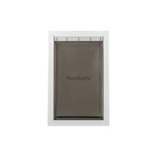 White-framed PetSafe pet door with a tinted flap.
