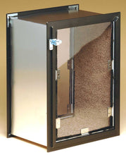 A metal box with a framed door featuring a brown textured material inside.