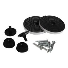 The image shows a collection of hardware components including black plastic feet and knobs, a pile of screws, and rolls of adhesive-backed foam.