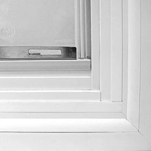 Close-up of a white vinyl window frame.