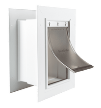 A white PetSafe pet door with a flexible tinted flap.