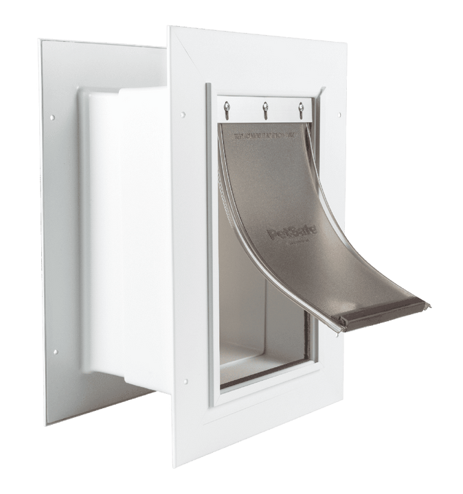 A white PetSafe pet door with a flexible tinted flap.