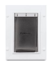 A PetSafe brand pet door in a white frame.