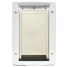 A white PetSafe pet door with a replacement flap.