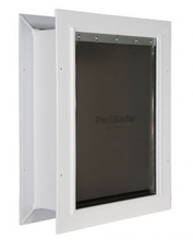 White-framed pet door with a dark tinted flap.