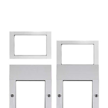 Two white metal frames with rectangular openings, one detached.