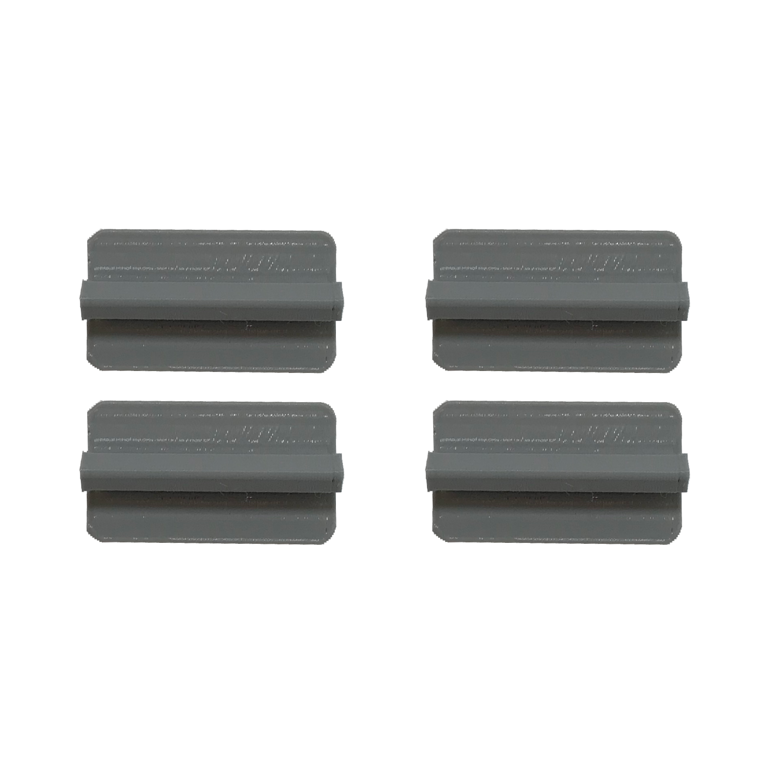 Four gray, rectangular objects with a raised bar in the center on a white background.