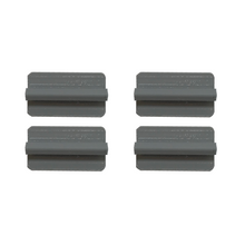 Four gray, rectangular objects with a raised bar in the center on a white background.