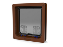A brown-framed pet door with 