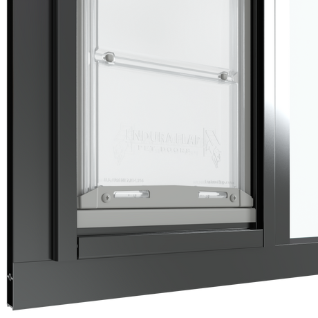 The bottom section of the black Thermo Sash 3e pet door for sash window is shown closed in a sash window