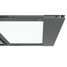 The top section of a black Thermo Sash 3e sash window pet door is shown closed in a window, illustrating its integration with the sash window frame