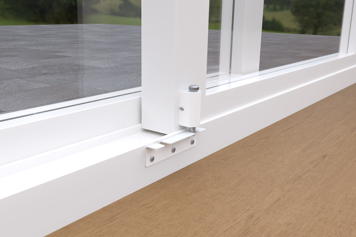 Close-up of a white sliding glass door frame with mounted hardware.