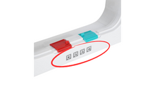 Close-up of a white plastic dispenser with a red and a blue slider, and four black icon symbols on a white surface.