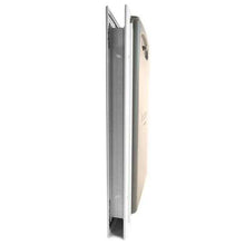 Side view of a closed book next to a smartphone.