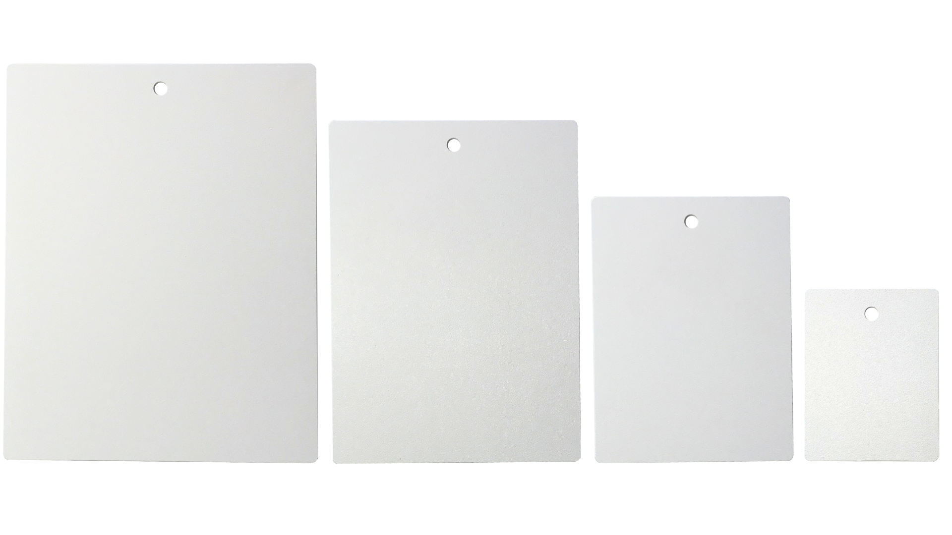 Four blank white tags of varying sizes with a hole at the top, arranged from largest to smallest.