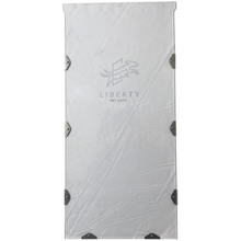 A white Liberty Pet Door replacement flap with metal hardware.