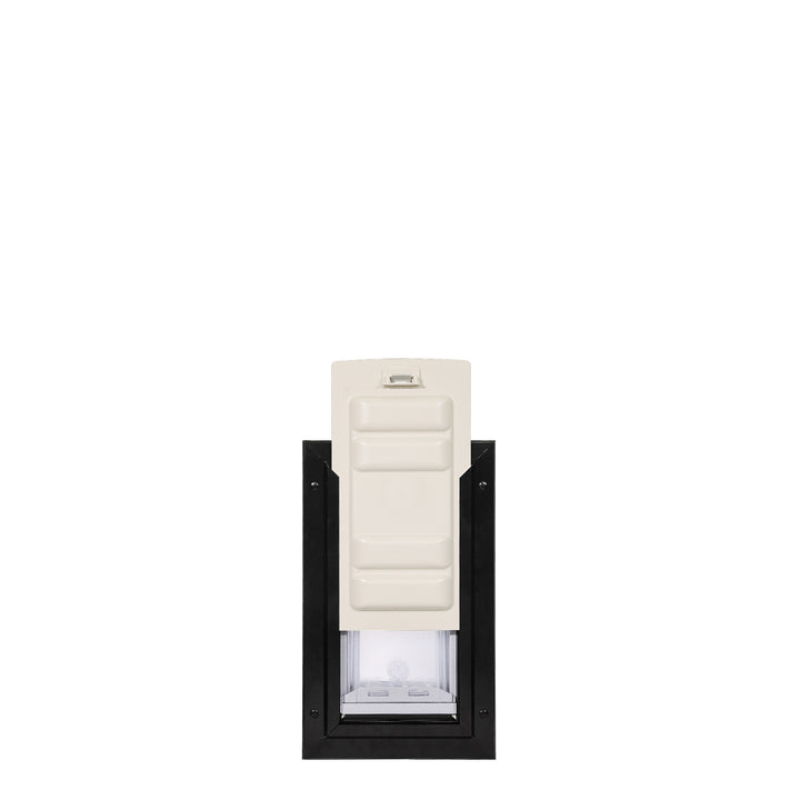 A pet door with a black frame and an off-white slide.