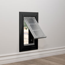A pet door is installed in a wall.
