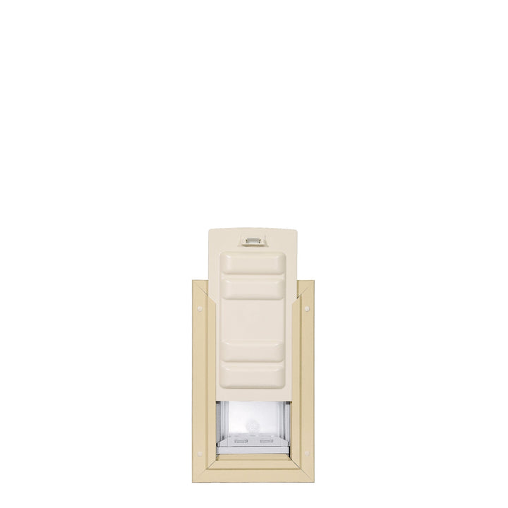 A beige pet door with a white closing panel.