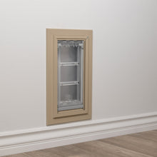 A pet door is installed in a wall above the baseboard.