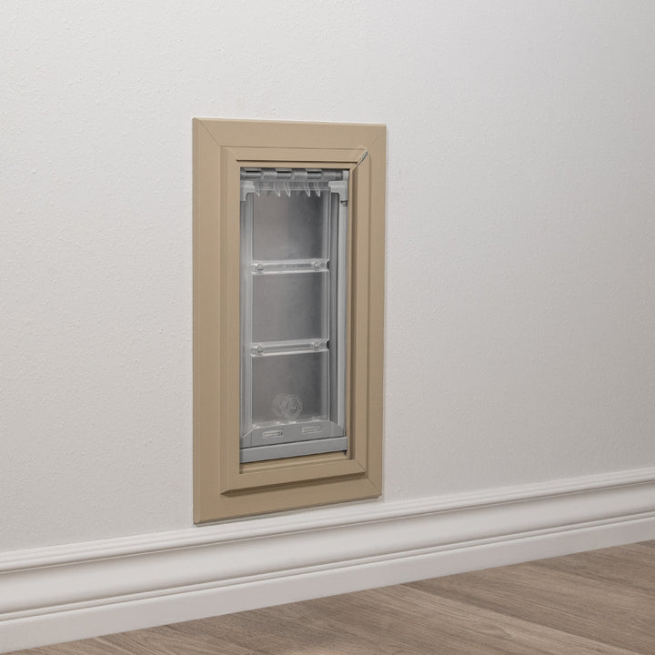 A pet door is installed in a wall above the baseboard.