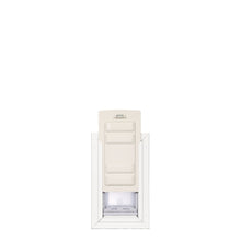 A pet door is set in a white frame.