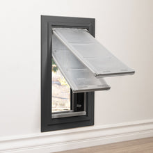 A black framed pet door with two open flaps is installed in a wall.