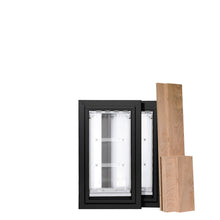 Two pet doors with black frames and transparent flaps, accompanied by several unfinished wood planks.