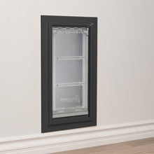 An Endura Flap pet door installed in a wall.