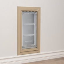 A pet door installed in a wall.