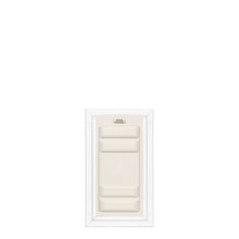 White pet door with a locking mechanism.