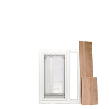 White-framed pet door insert with wood pieces.