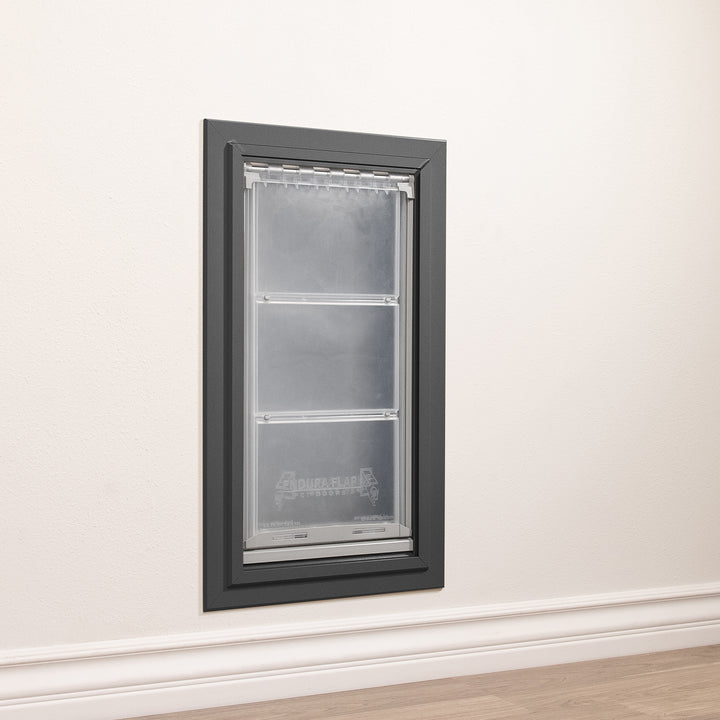 A pet door is installed in a wall.