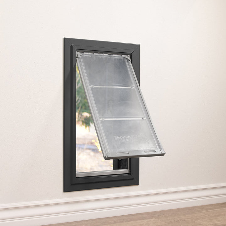 A dog door is installed in a wall.