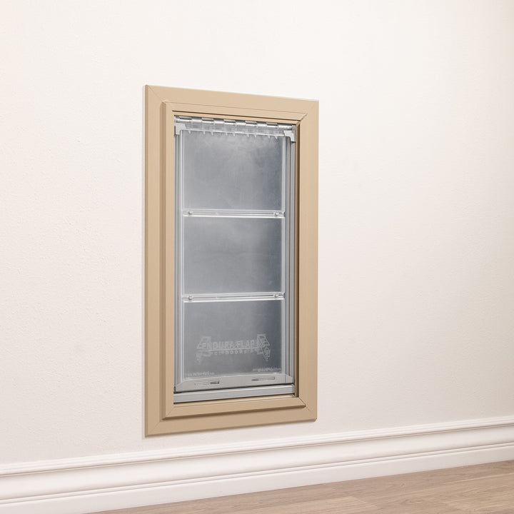 A dog door is installed in a wall.
