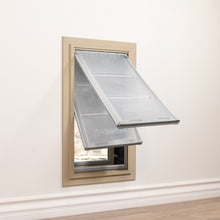 A pet door with two open flaps installed in a wall.