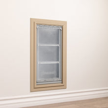 A DuraFlap pet door is installed in a wall.
