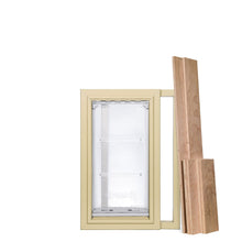 A pet door with a tan frame and clear flap, accompanied by wooden planks, is shown.