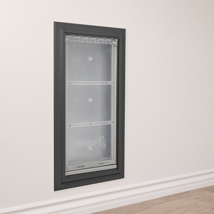 An "Endura Flap Pet Door" is installed in a wall.