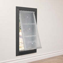 A pet door with a transparent flap is installed in a wall.